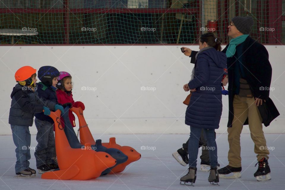 Happy Family On Ice Rink