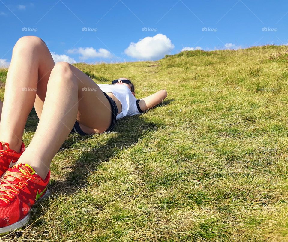 the young girl enjoys the warmth of the sun