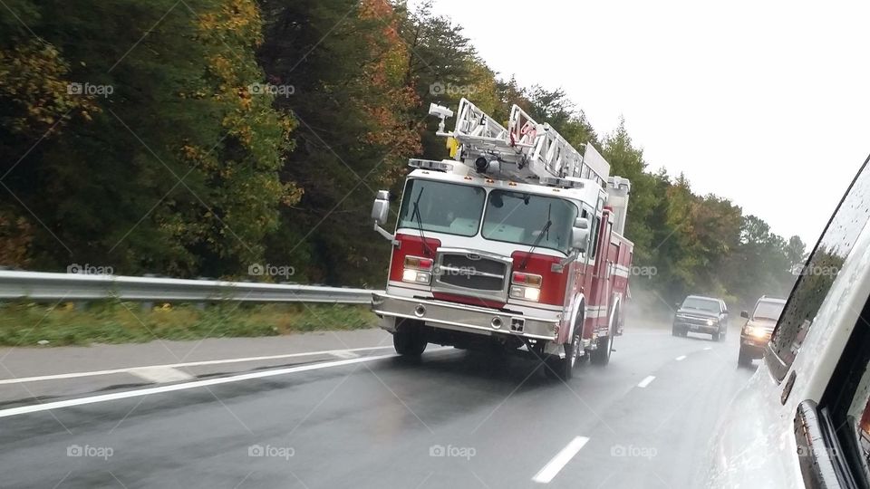 Fire truck going down the road. 