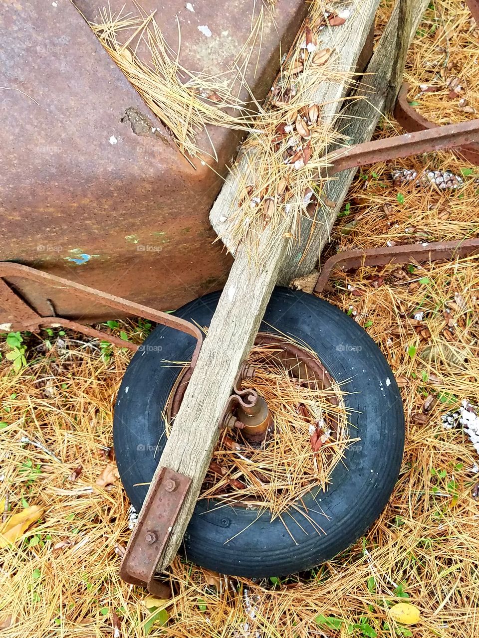 Front end of old rusty wheelbarrow, handmade.