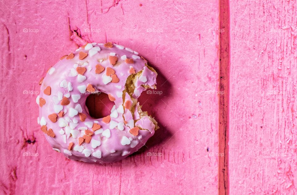 Pink donut on a pink table