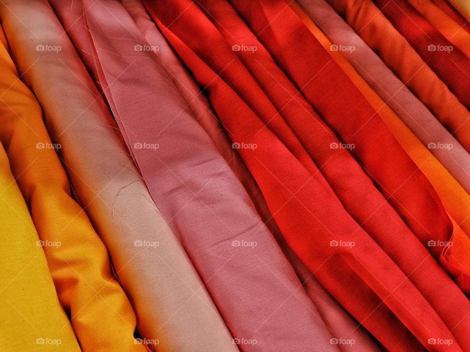 Red Fabric. Brilliant Bolts Of Fabric In Various Hues Of Red
