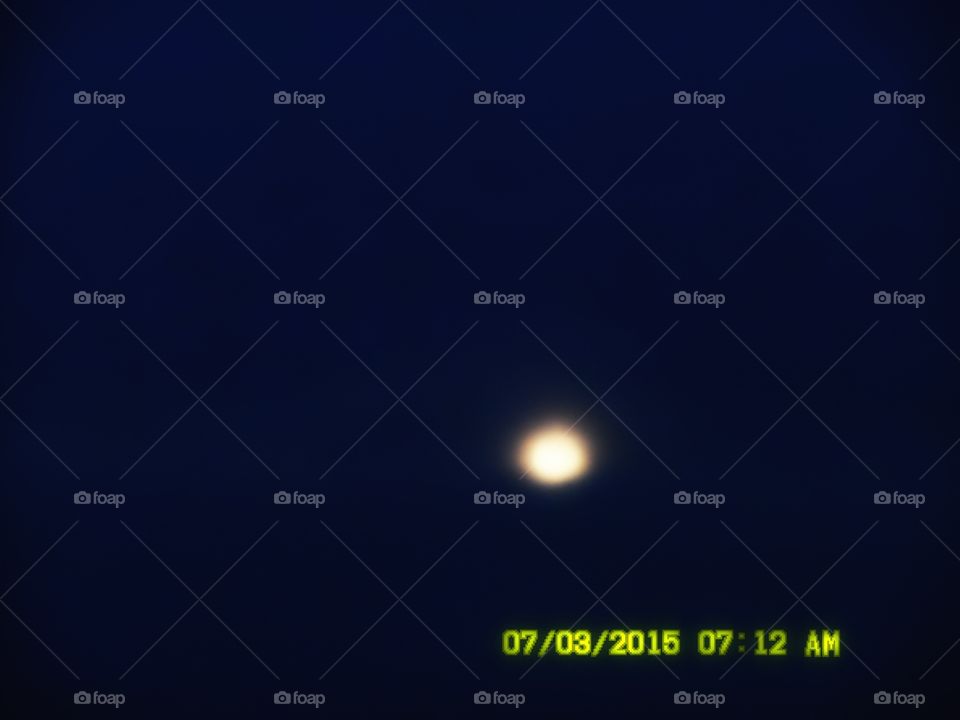 blue moon 🌚. This is a picture of the moon 🌚 that I saw this morning before I left for 👷 work. I took this picture near Graham Texa