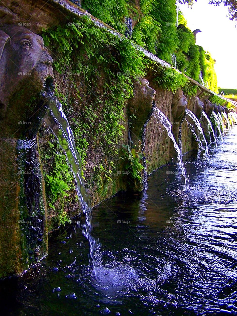 Row of fountains at the Renaissance villa of Tivoli just outside Rome in Italy