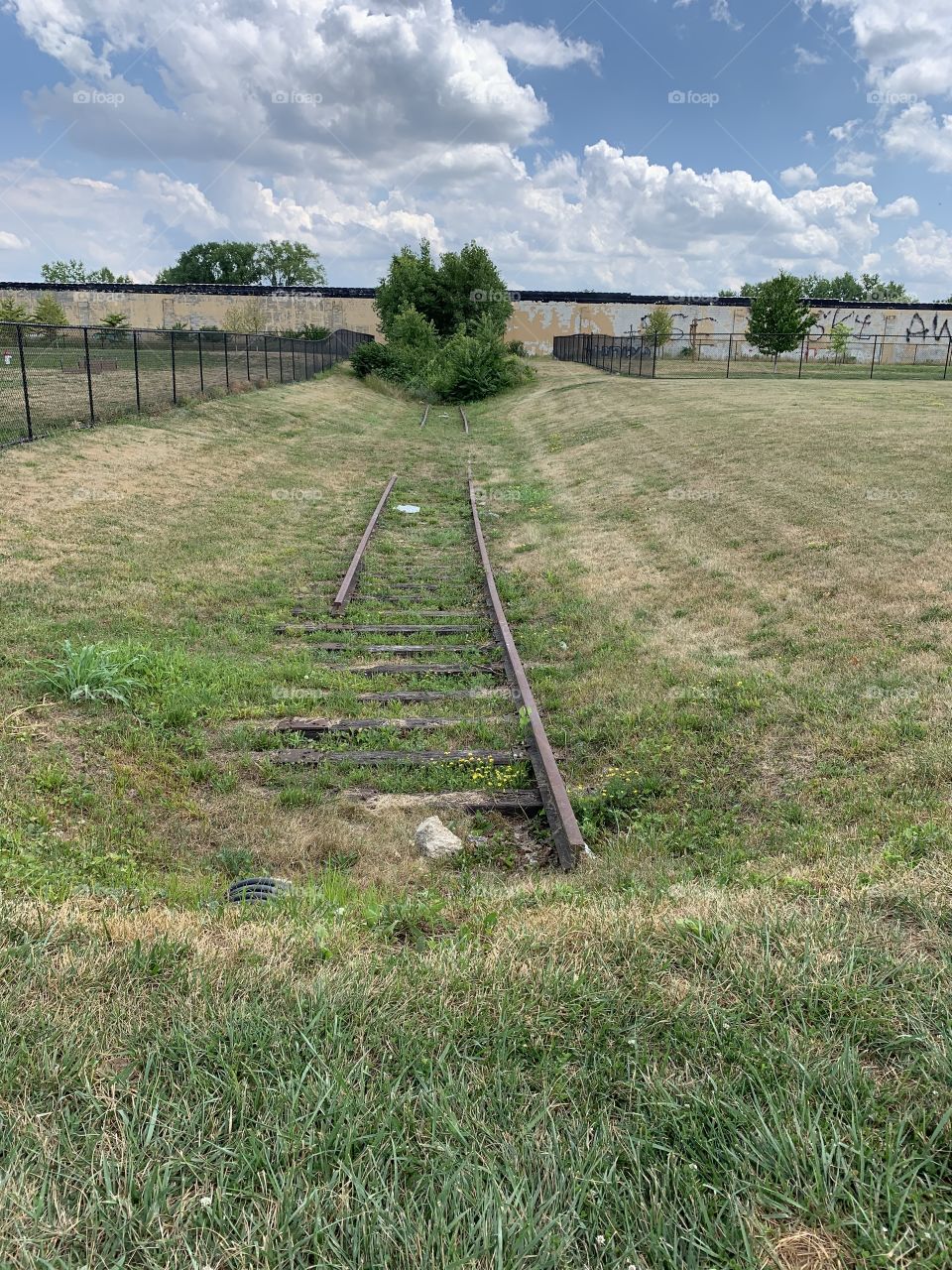 Railroad tracks that lead to nowhere. They’ve long been abandoned. A city took over. 