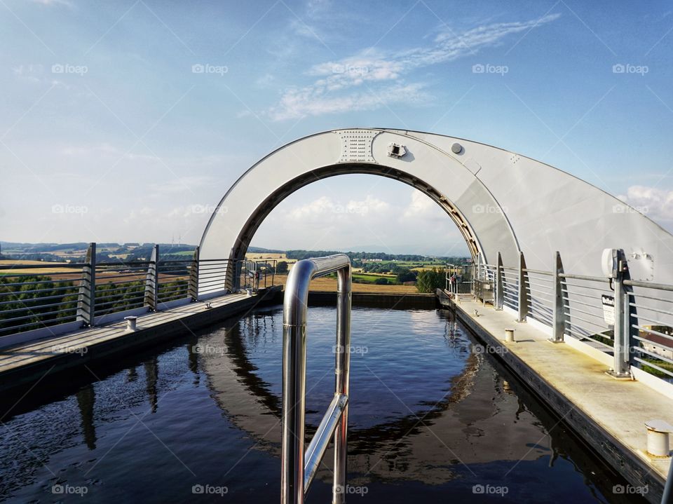 The Falkirk Wheel ...The most unusual bridge I have ever been on ... Like a giant Ferris wheel carrying boats !Photo taken from the front of the barge floating high above the ground as we move to reach the canal down below ....