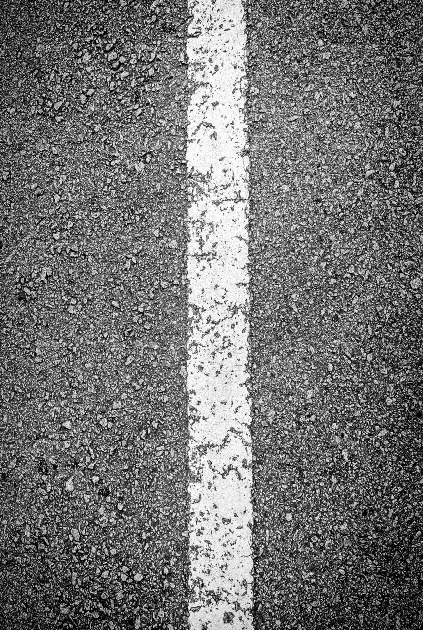 White line on black asphalt road