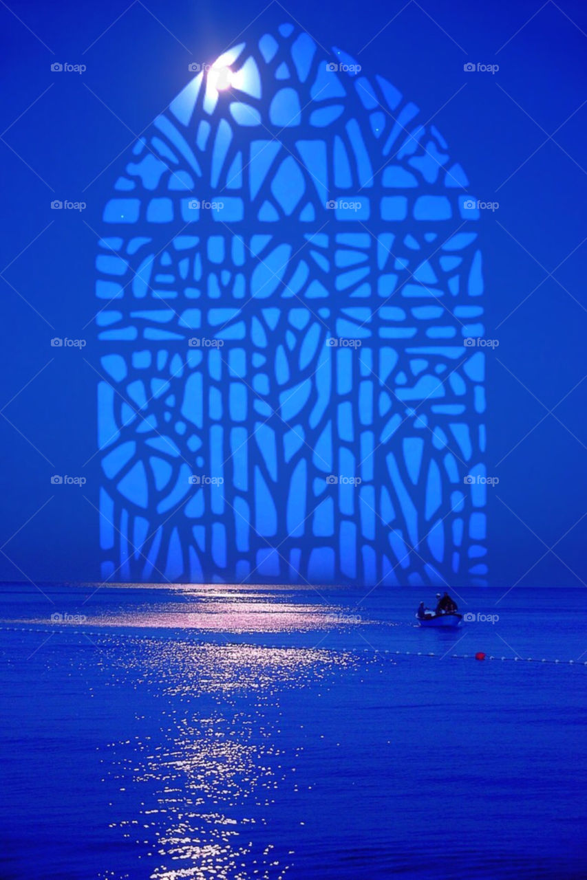 Scenic view of boat in front of arch window