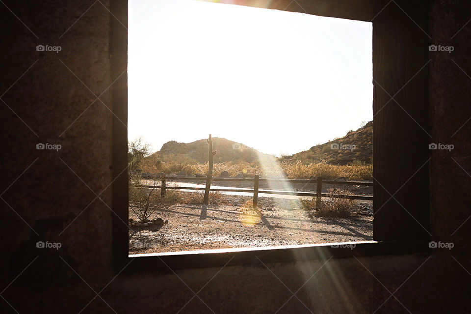 Sun ray coming through window in desert 