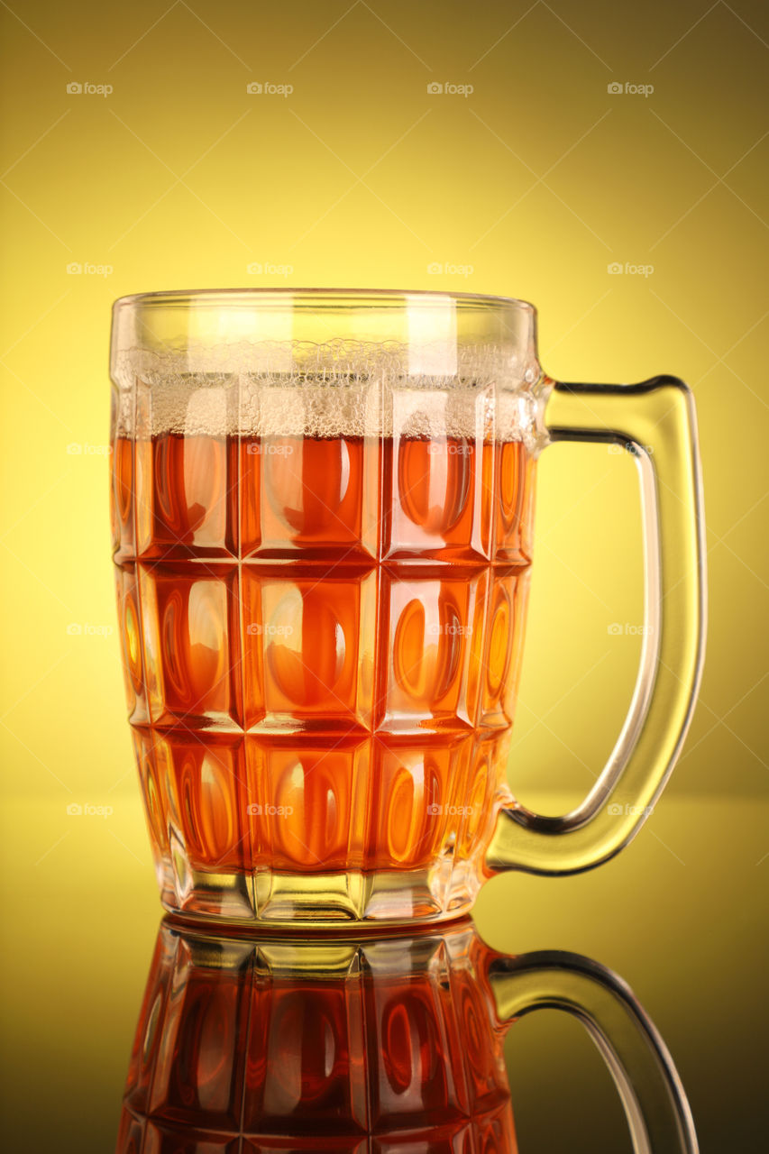 Beer mug on a yellow background