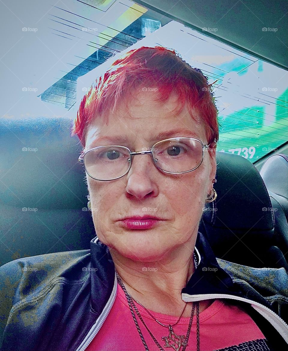 I, “Petra Schiller” a.k.a. “Maxine Firefox” am riding back home in a car from “Clinton Hill”, Bklyn to “Newtown Creek” in LIC, Queens wearing my sequined hot pink “PEACE - LOVE” shirt gently smiling to myself. 2021. Hypnotic Productions