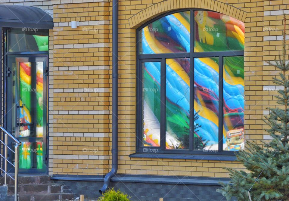 color reflection in the windows of an apartment building