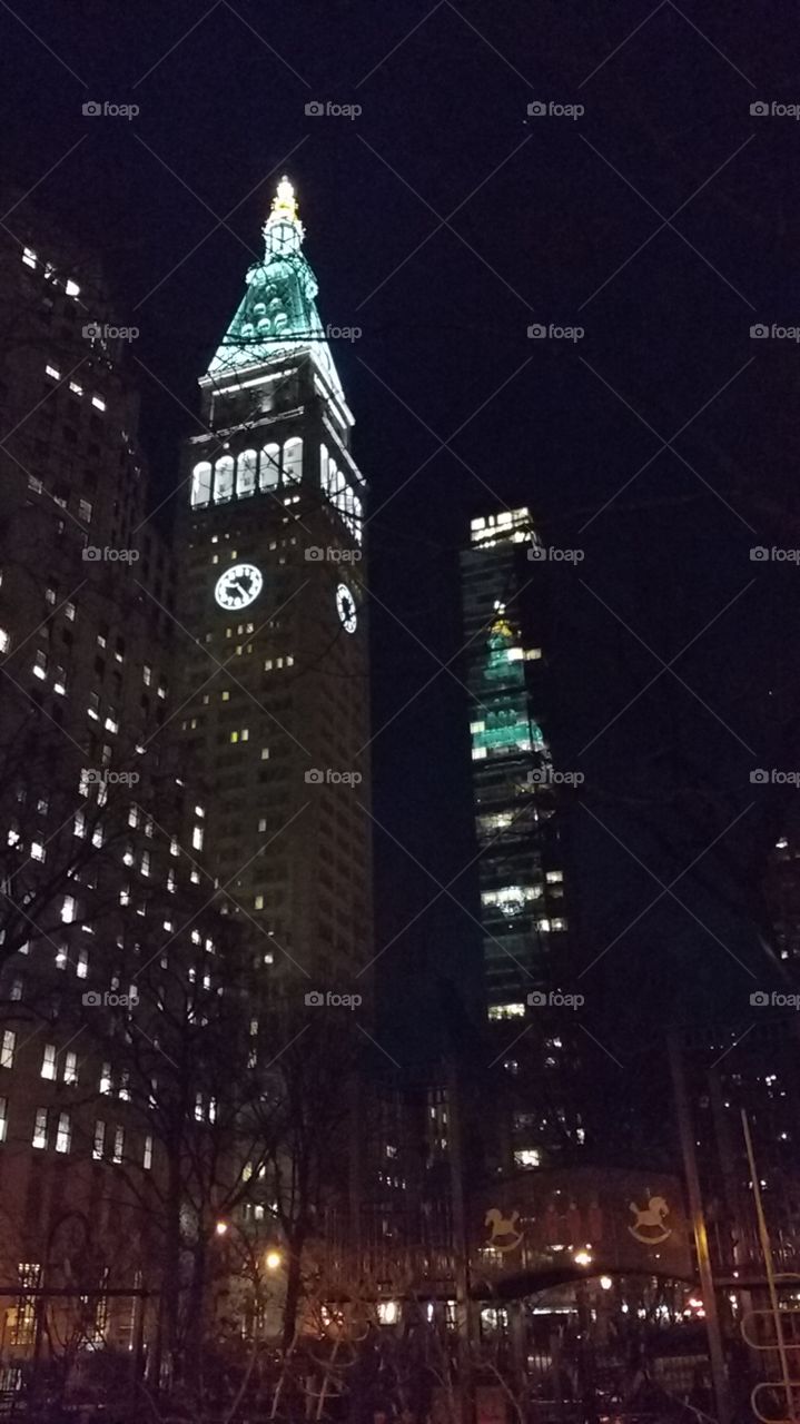 Night shot of a building and it's reflection in another building