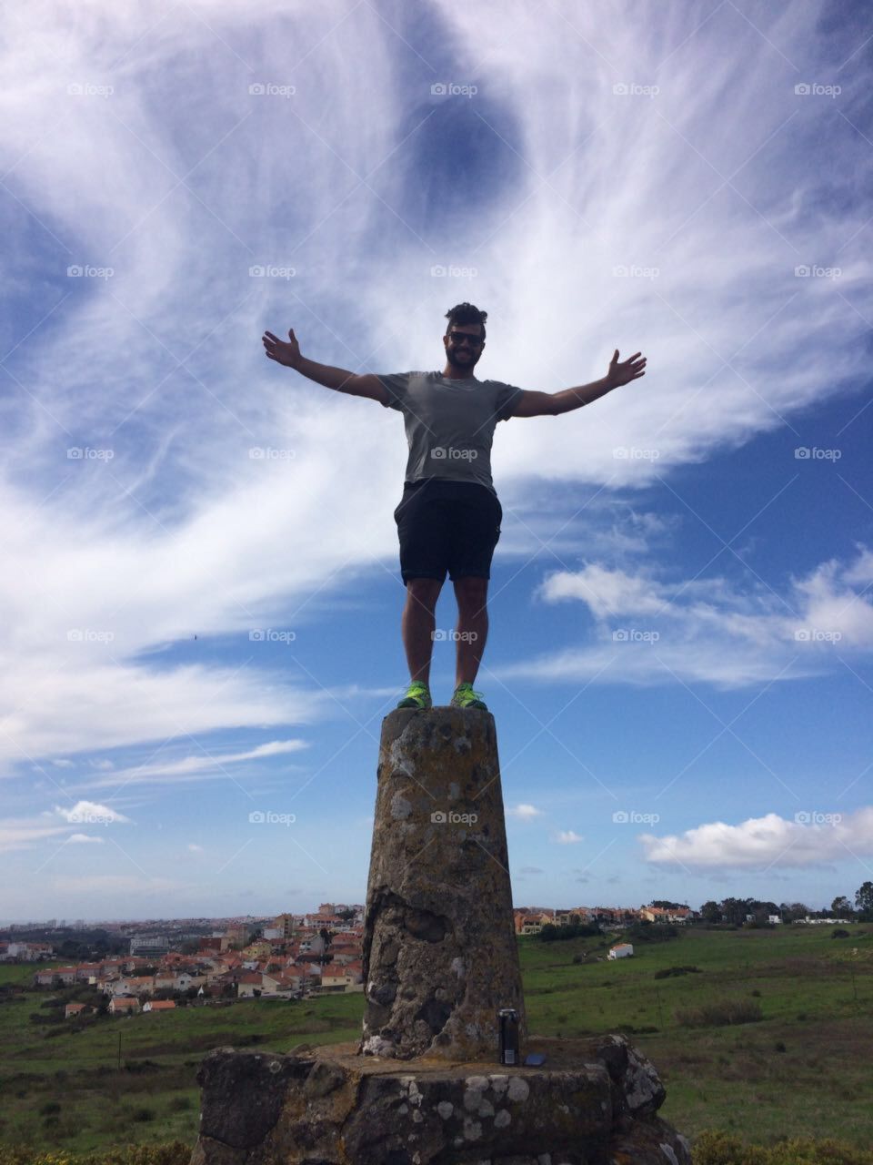 Man standing on top of stone structure