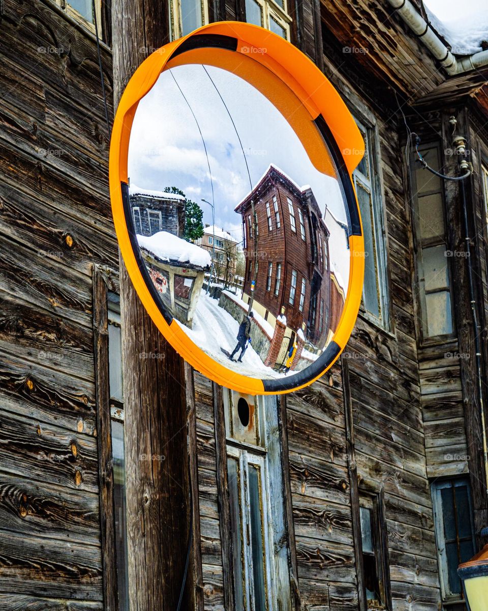 mirror to wooden house