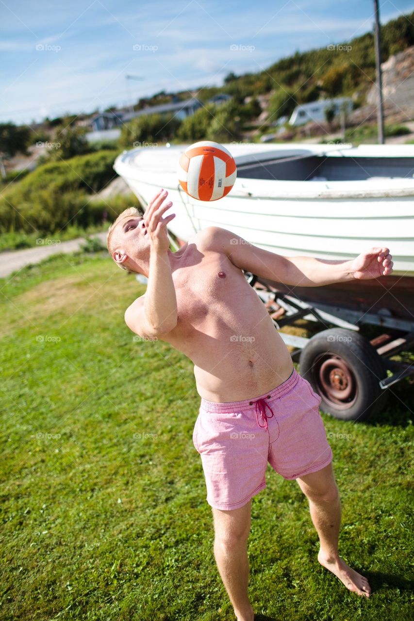 Man playing with volleyball