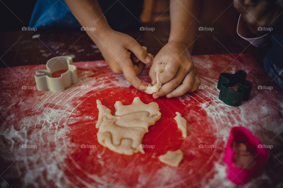 Little sisters cooking the biscuits 