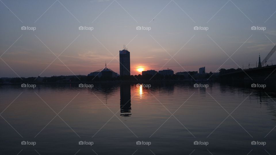 A beautiful sunset over city panorama with river in Riga, Latvia