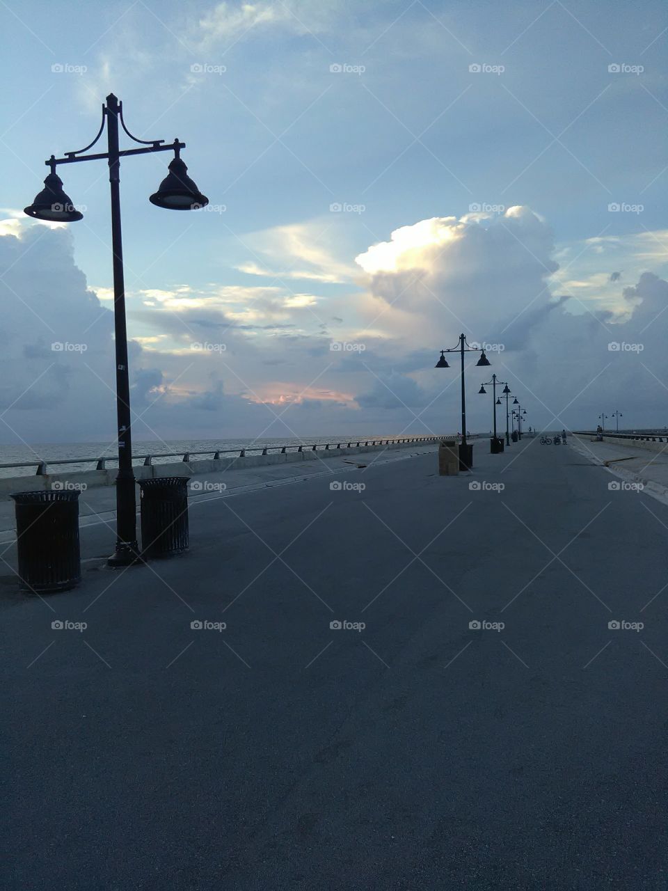 Sunrise on the pier in key west, pastel clouds