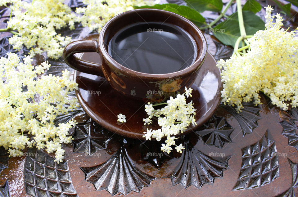 Coffee cup on a wood-carved table 1