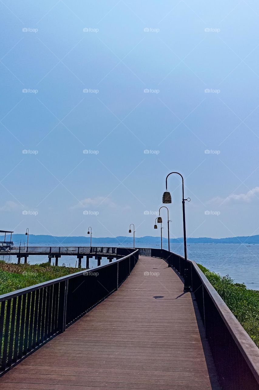 Wooden bridge at the swamp edge tourist spot in eye angle view