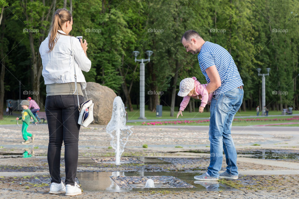 family near fountain