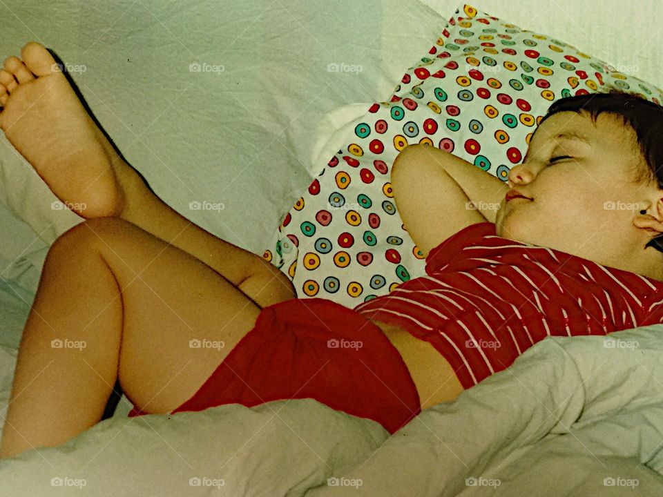 Cute girl sleeping on bed