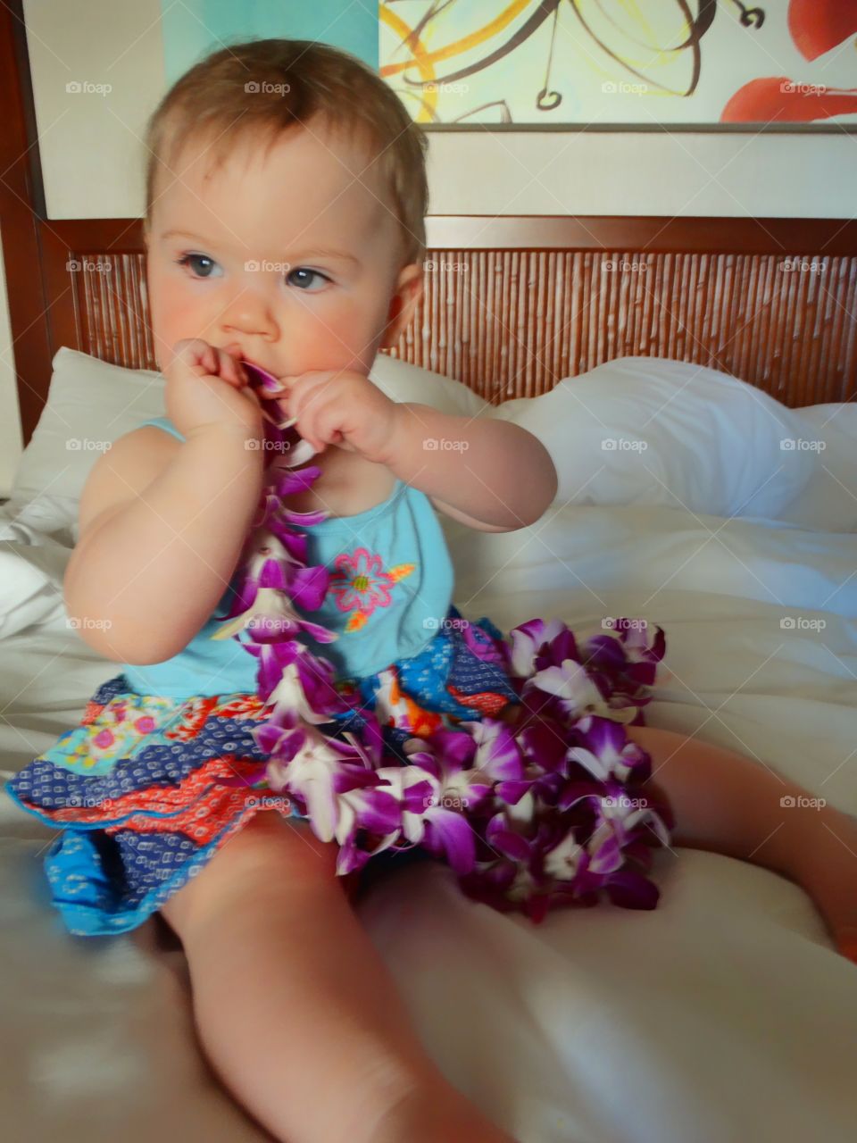 Baby Girl Wearing An Orchid Lei In Hawaii