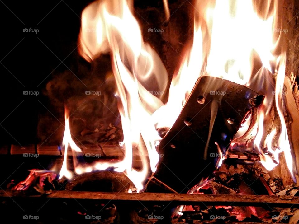 Old guitar burning in fire