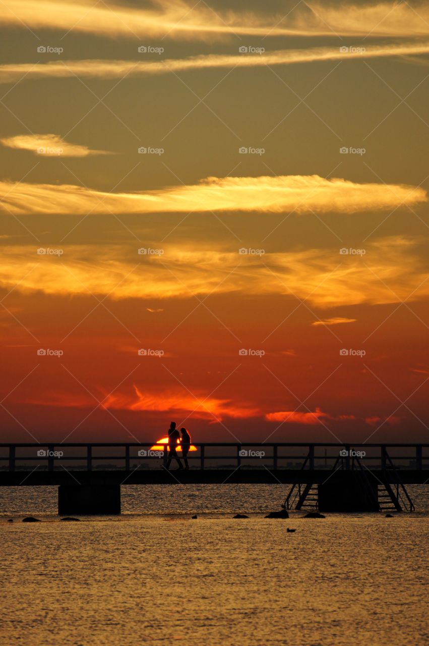 Silhouettes on a jetty