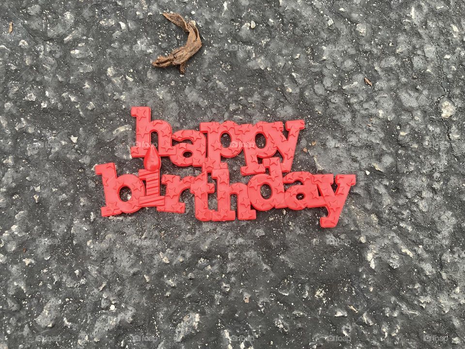Happy birthday sign on the ground 