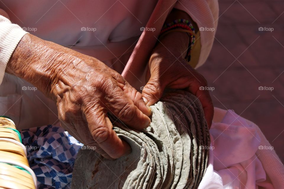 Senior woman holding chapatti