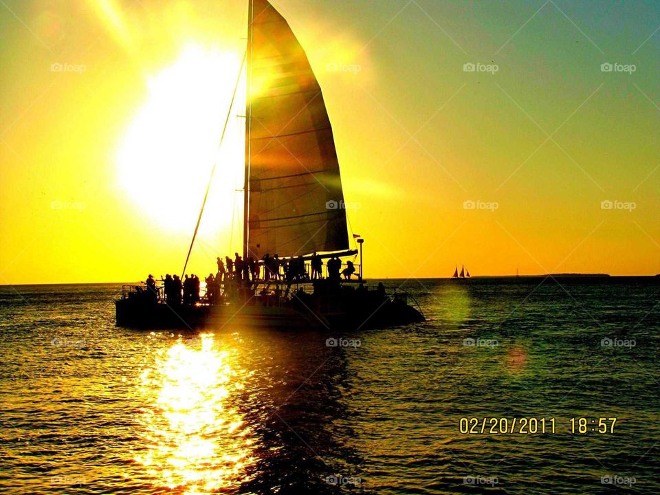 sunset coming through the sailboat in Key West