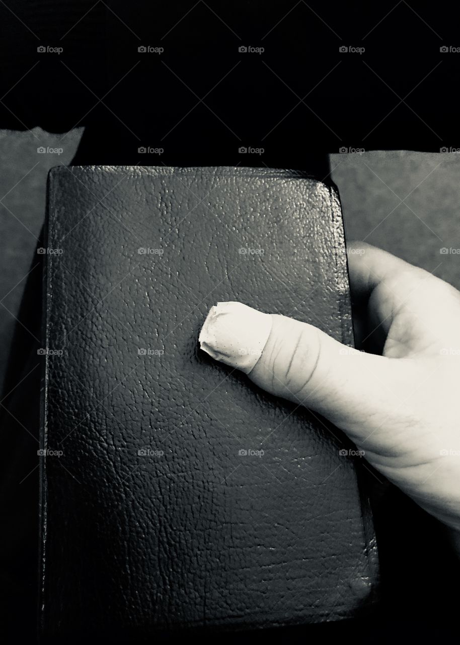 Holding a Bible with a broken thumb 