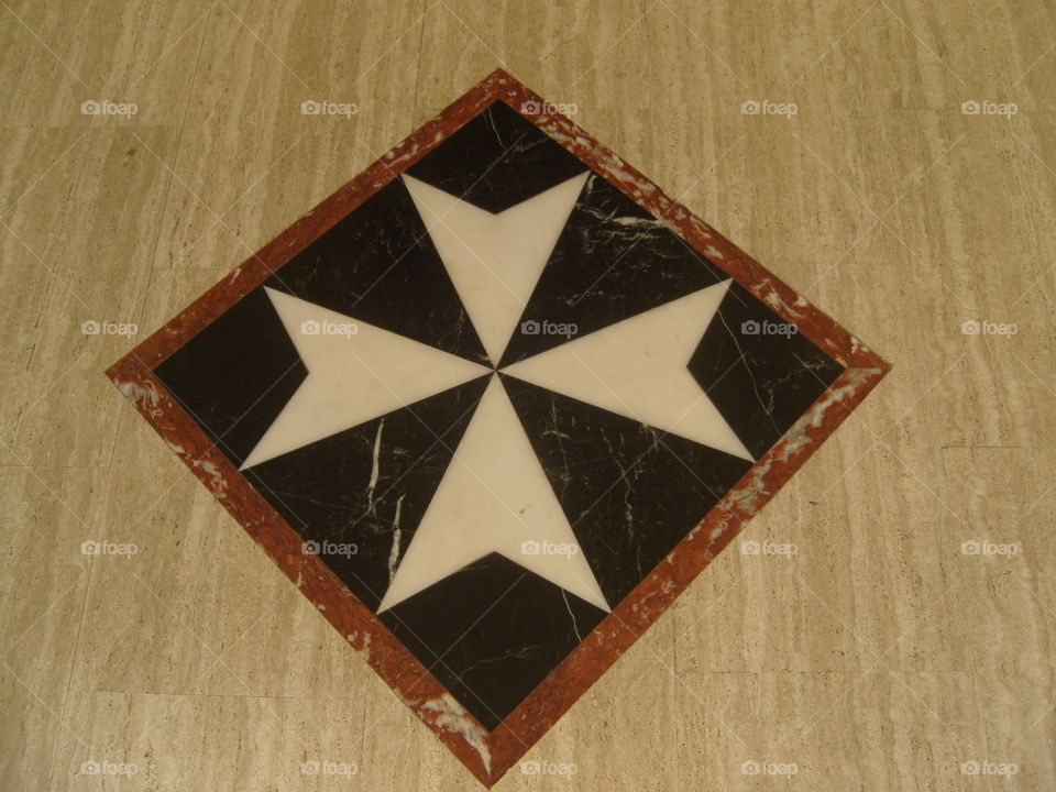 Malta Maltese cross on the floor if Saint John church Bugibba