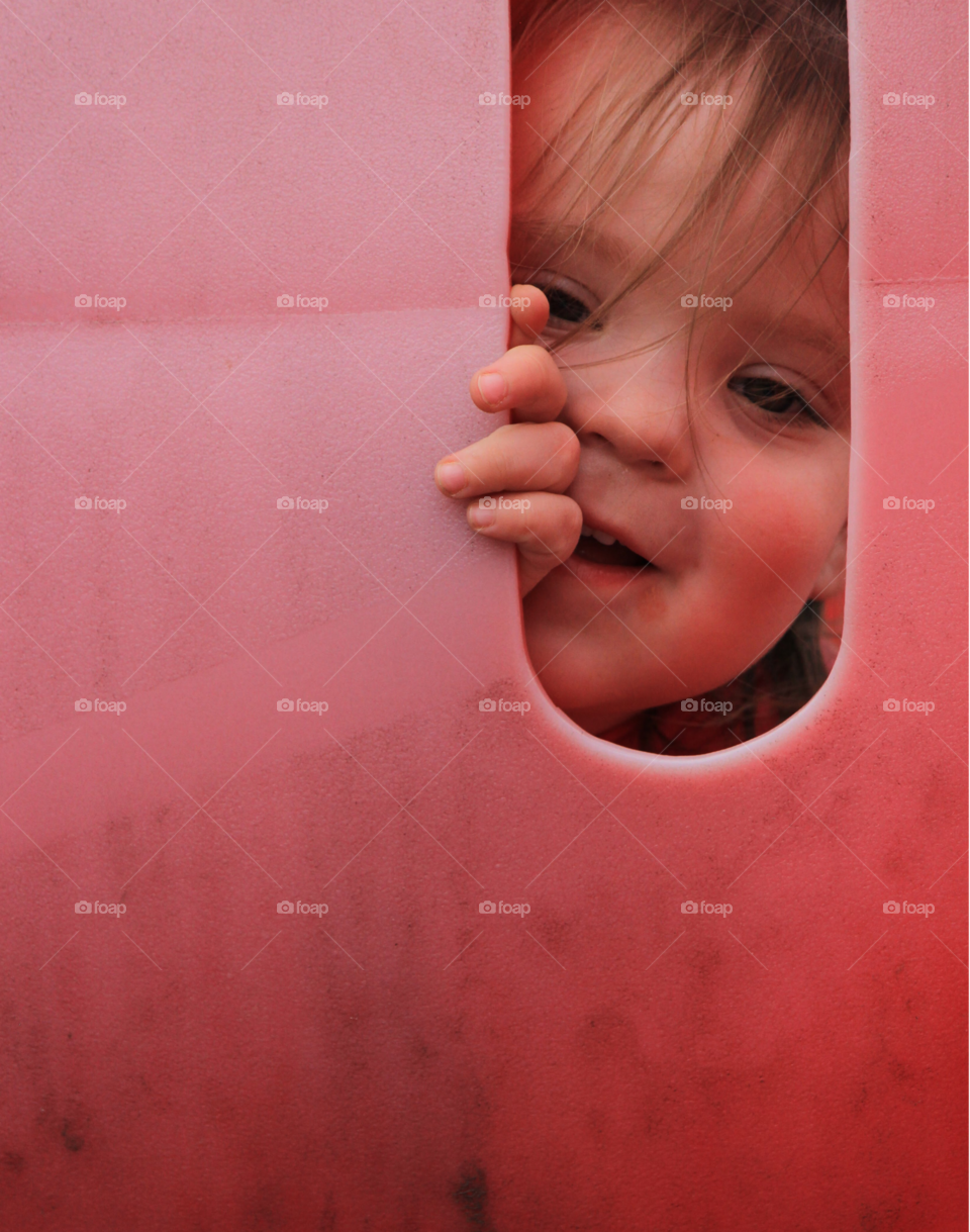 Close-up of a boy looking through hole