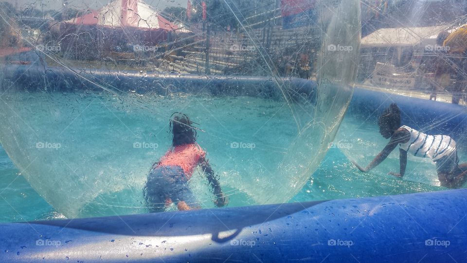 Carnival Fun. Girls in Giant Bubbles