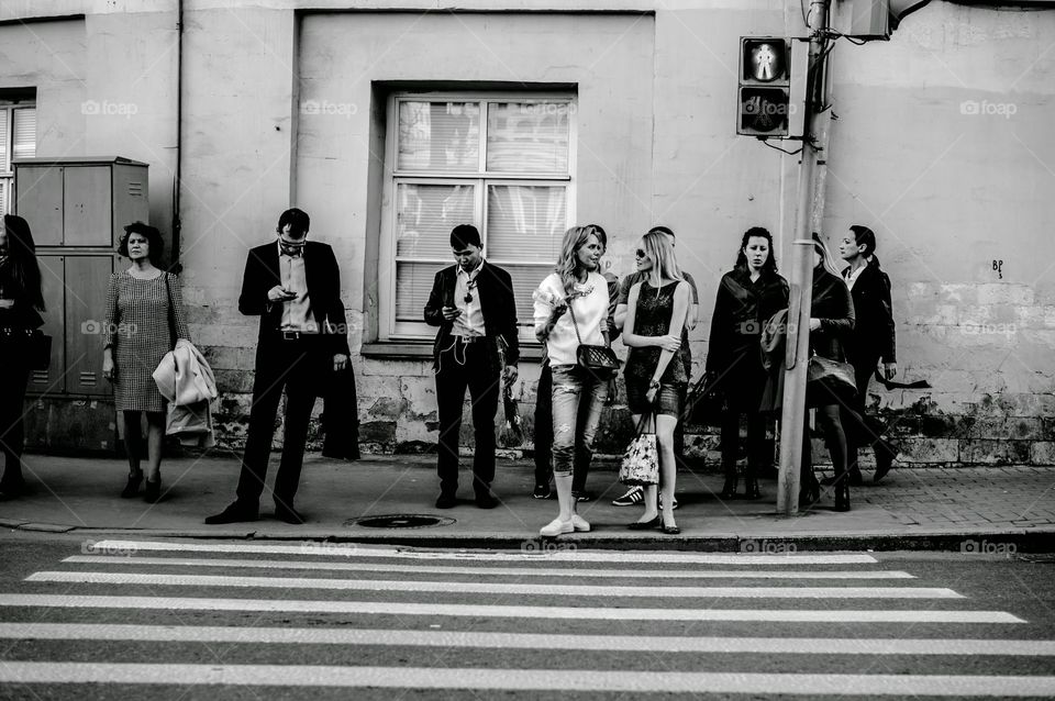 People are waiting to cross the street