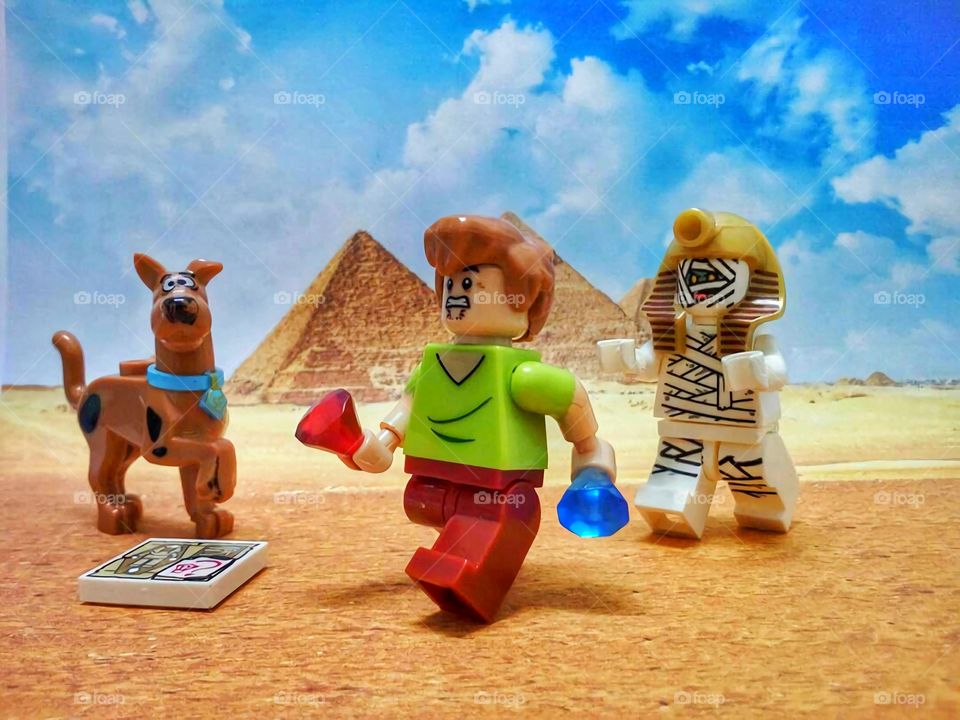 Close-up of toys infront of egypt pyramid