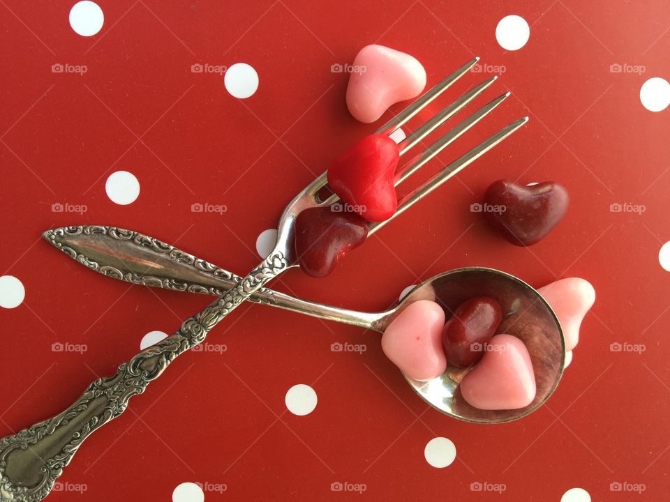 Spoon and fork with Valentine candies