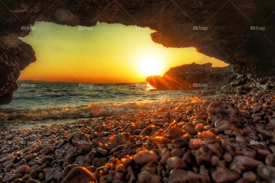 Sunset seen from a cave