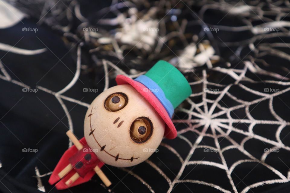Halloween. Ghost doll with cobweb. hallowen background.