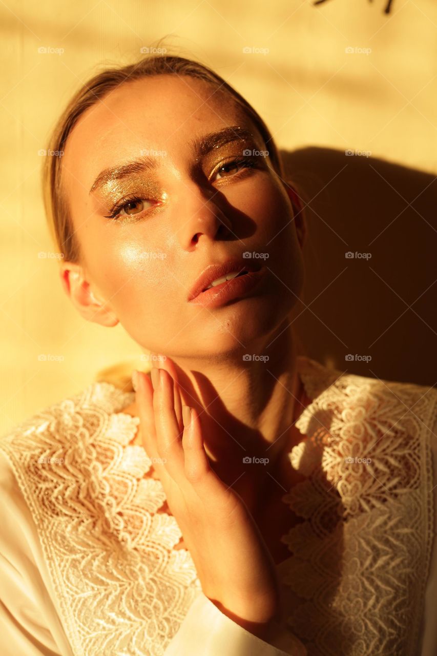 portrait photo of a young woman with bright makeup