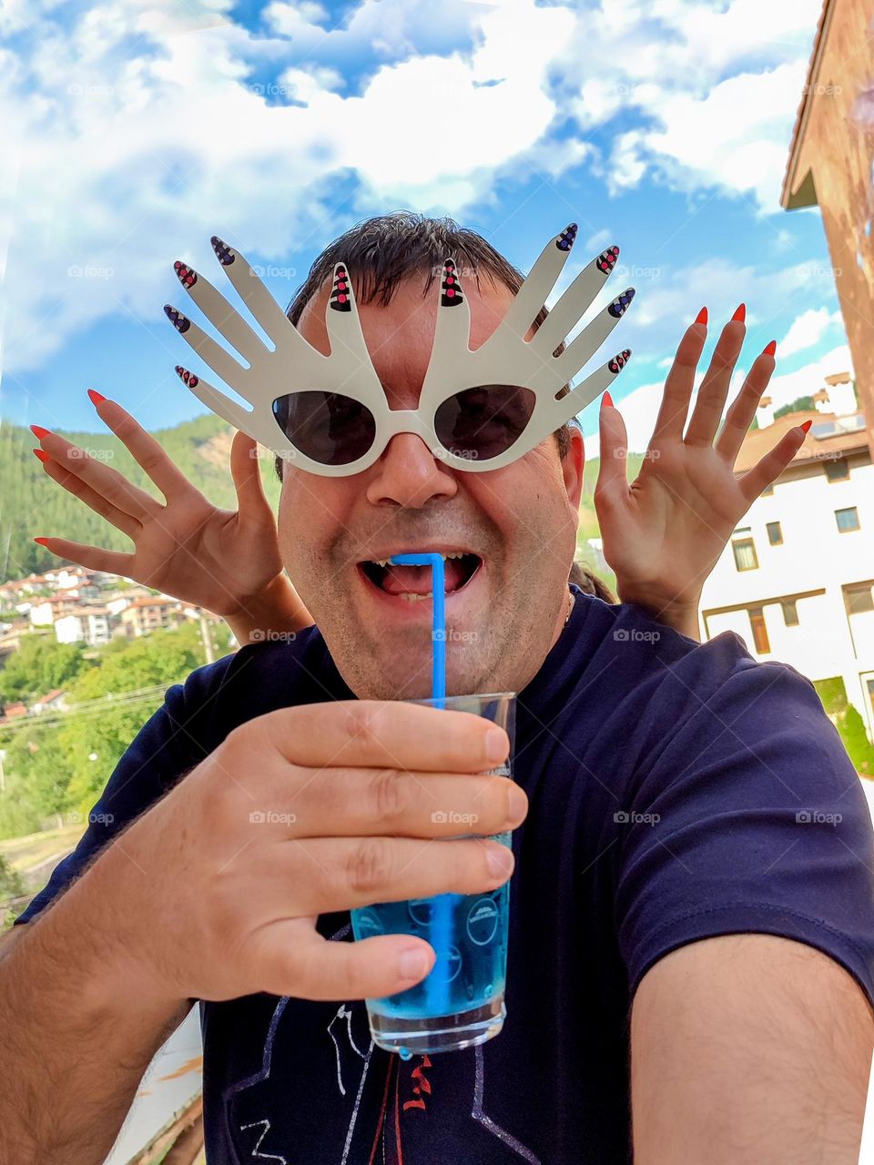 Energetic, Light-Hearted Funny Selfie with Cocktail and Sunglasses