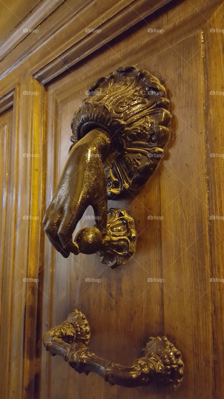 knocker shaped like a hand