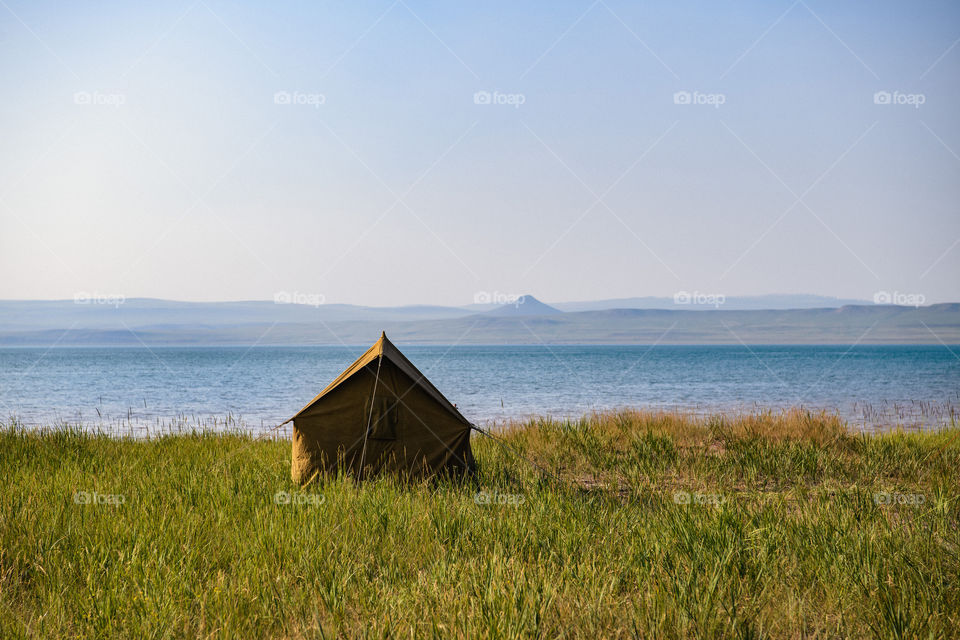 A camp on a lake shore