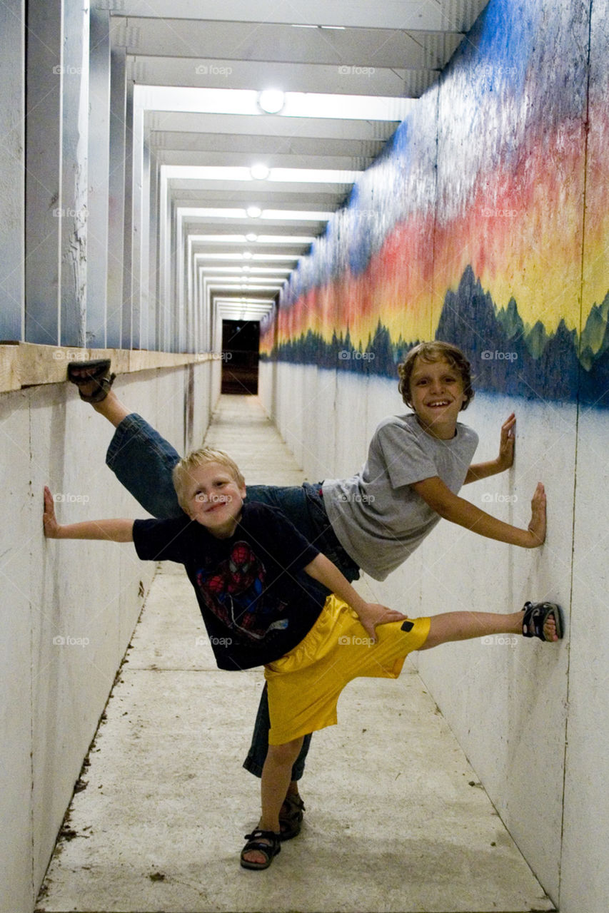 Silly Walks. Children silly walk through a construction walkway