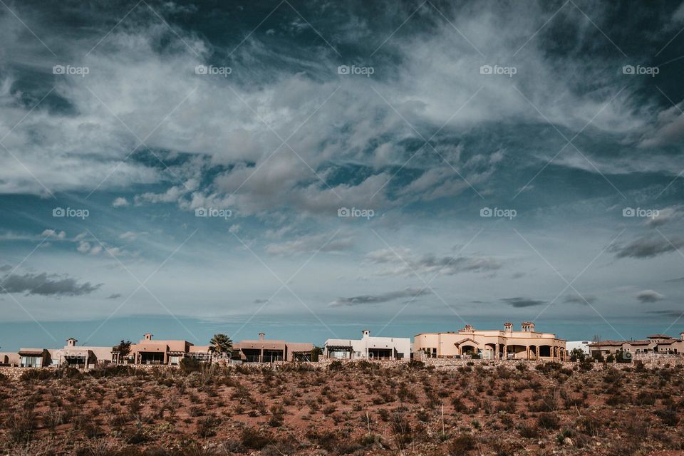 Houses Under Blue Desert Sky