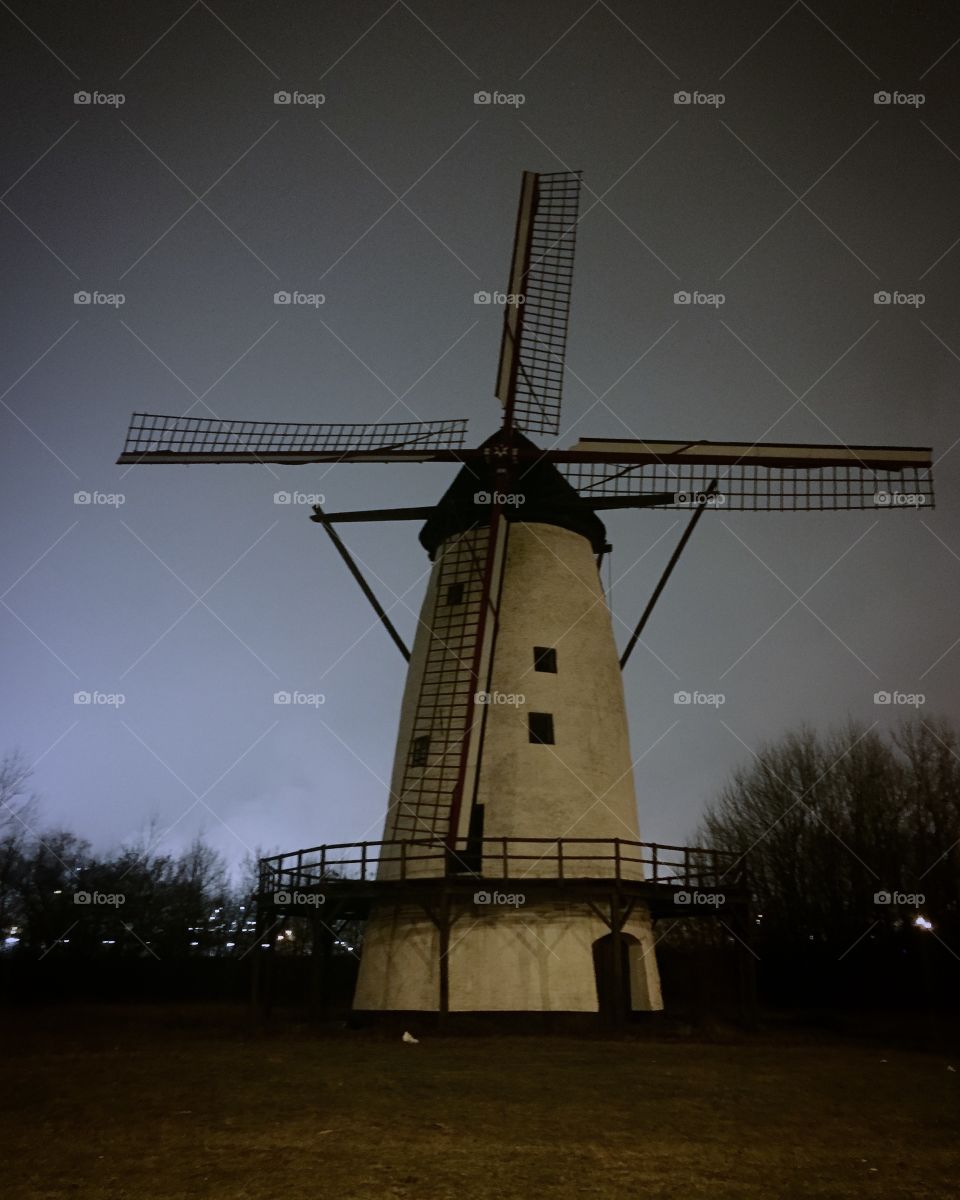 Vintage windmill at night 