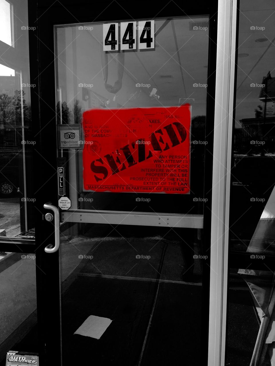 Seized sign on business door, bright orange!

Sign of the times today as businesses are closed. This was obviously a forced closure for some reason. Sign was on every door, never saw one of these & felt bad.